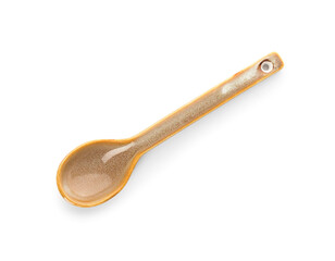Ceramic beige spoon on white background