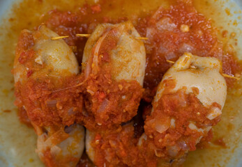 Seafood. Top view of stuffed squids with tomato sauce
