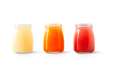selection of grapefruit and orange juices in open glass bottles with shadow isolated on transparent background