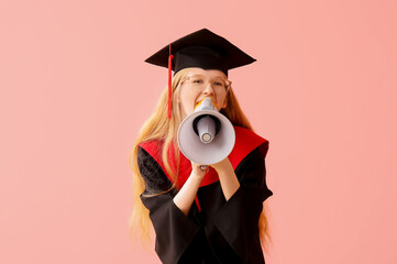 Female graduating student in mortar board with megaphone on pink background