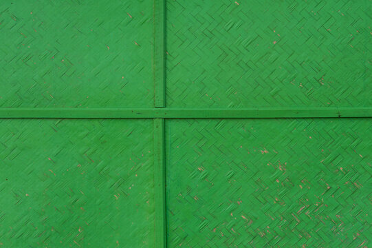 Green woven bamboo walls in the countryside