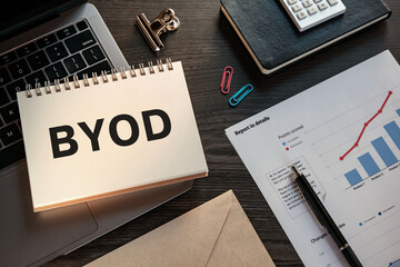 There is notebook with the word BYOD. It is an abbreviation for Bring Your Own Device as eye-catching image.