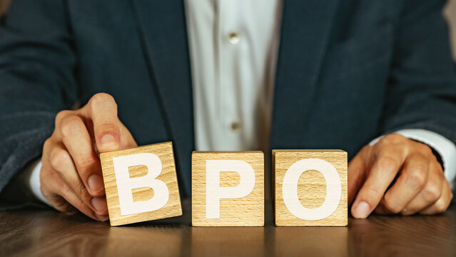 There is wood cube with the word BPO. It is an abbreviation for Business Process Outsourcing as eye-catching image.