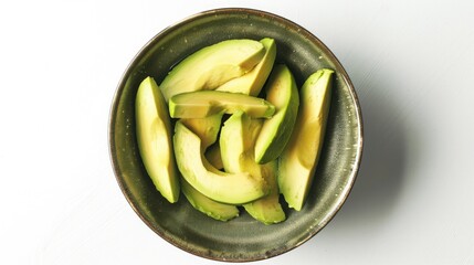 Sliced avocado in a bowl top view on white background