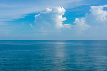 Beautiful blue landscape with a horizon of white clouds over the blue sky.