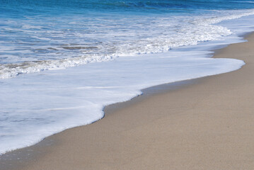 Sea foam on the beach