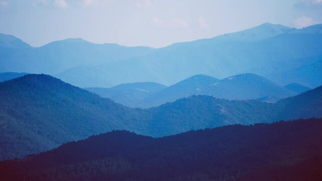 Mountaineer hiker pov from high altitude summit to large mountain range massif. Amazing landscape background