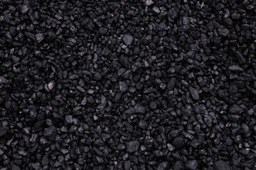 Black textured background made with black coals