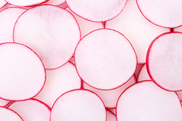 Slices of fresh ripe radish as background, top view