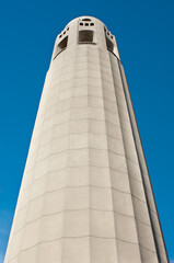 Coit Tower against a blue sky.