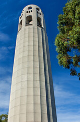 Coit Tower against a blue sky.