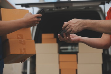 Asian delivery express courier young man use giving boxes to woman customer he wearing protective face mask at front home