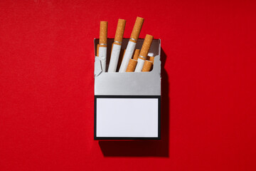 A pack of cigarettes on a red background