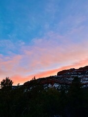 sunset over snow covered canyons