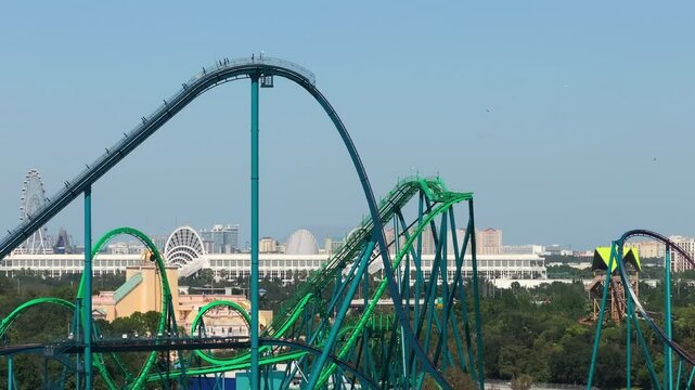 Excited fun of enjoying thrilling rollercoaster at amusement park in Orlando, Florida.