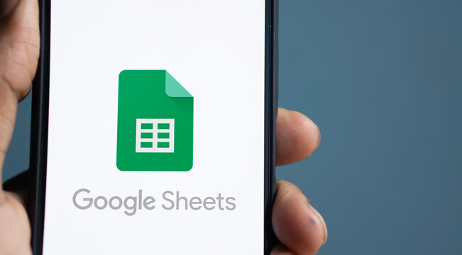 Dhaka,Bangladesh - 08July2024: Google Sheets logo is displayed on smartphone.