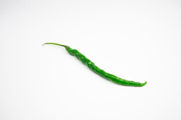 Single curly green chili. typical Indonesian, isolated on a white background.
