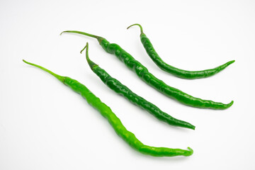 Curly green chilies in clusters. typical Indonesian. isolated on white background.