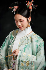 Asian,woman,showing,court,costumes,of,the,Qing,Dynasty,in,China