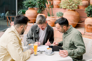 happy young couple signing contract