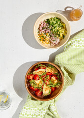 Summer Dishes: Refreshing Okroshka and Grilled Halloumi with Tomatoes Displayed on White Background