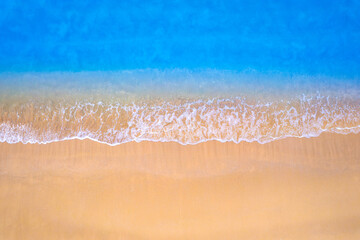 Top view beach sand background for summer vacation concept. Beach nature and summer seawater with sunlight light sandy beach Sparkling sea water 