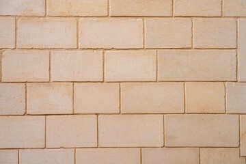 Background from a wall made of big blocks of bricks