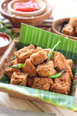 Sumedang tofu (tahu sumedang) on a wooden table. Perfect for recipe, article, catalogue, or any commercial purposes.