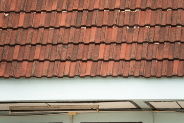 A red roof with a white trim