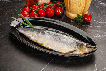 Whole raw salted herring fish