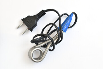 A device for heating water, a boiler, of small size lies on a white background.