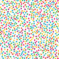 Seamless pattern featuring colorful confetti sprinkles scattered background