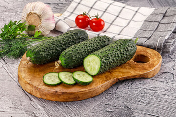 Raw green cucumbers with slices