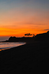 Sunset on the beach by the ocean, Indonesia.
