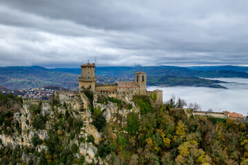 San Marino castle Guaita tower drone aerial view on a cloudy day