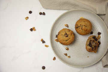 Top view of three muffins on a plate with room for graphics