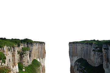 Steep cliffs on both sides with a gap in the middle. Isolated from the white background.