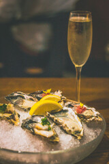 raw oysters with LEMON & TABASCO, SHALLOTS & RED WINE VINAIGRETTE, YUZU PONZU, DAIKON & SCALLION