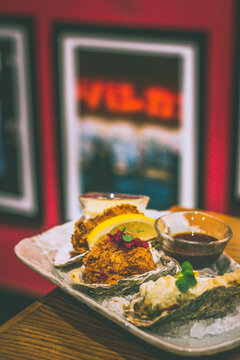 fried oysters including KAKI FRY made from oyster panko, egg mayo & lemon, OYSTER FRITTO with battered oyster & yuzu kosho mayo, CREAM KOROKKE with bechamel, chuno sauce & shibazuke.