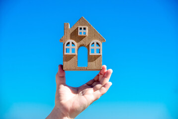 Girl holding the symbol of the house
