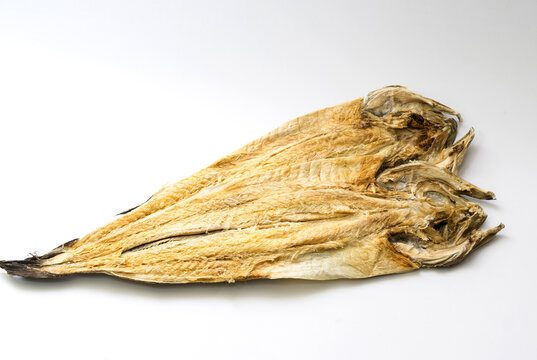 Close-up of two Hwangtae(dried pollack) on white floor, South Korea
