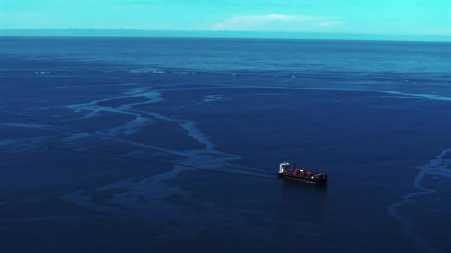 Ela Beach Port Moresby Papa Papua New Guinea Aerial drone cargo ship oil rig boat blue sky stunning sunny morning bay coastline hills PNG Capital City fishing wharf Harbor Idlers Bay static shot