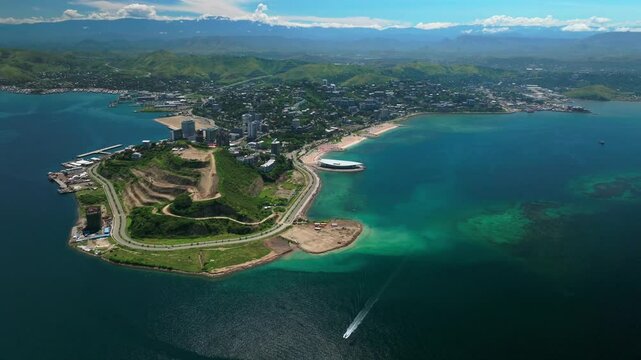 Ela Beach point boat Port Moresby APEC Haus Convention center Capital City Central Business District aerial drone Papua New Guinea PNG traffic Idlers Bay Hilton Marriot Crowne Plaza forward pan up