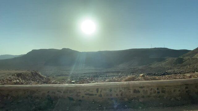 View of desert steppe from car window in Zagora Morocco