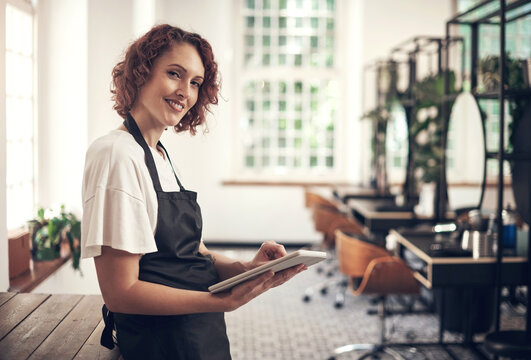 Smile, portrait and woman with tablet at hair salon for appointment, information and client records. Small business, stylist and person with tech at spa for online, schedule or beauty tips on website
