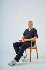 Fototapeta premium bearded Man in a surgical suit on a white background
