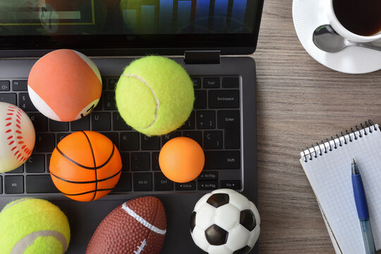 Entertainment with technology in sports with laptop and decoration balls - Powered by Adobe