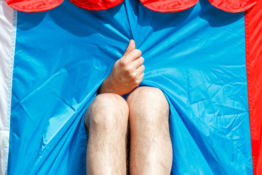 Close-Up of Person Relaxing in Colorful Circus Tent