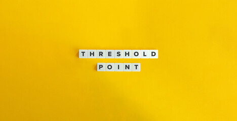 Threshold Point Term. a Specific Moment or Level at which a Significant Change Occurs. Text on Block Letter Tiles on Yellow Background. Minimal Aesthetics.