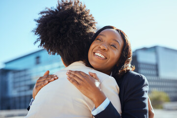 Joyful Embrace Between Two Women in Urban Setting